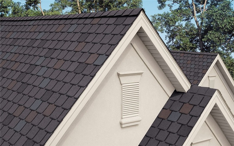 A stone-coated steel roof in a hexagon pattern on a white house
