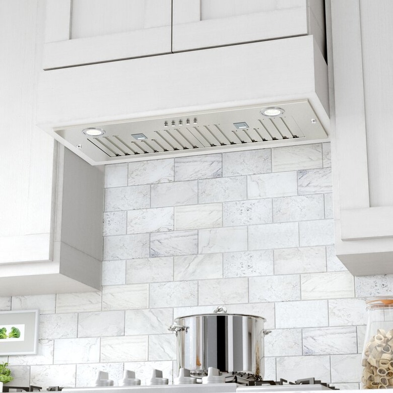 white kitchen with stove hood vent