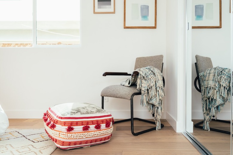 Bedroom corner with light wood floors