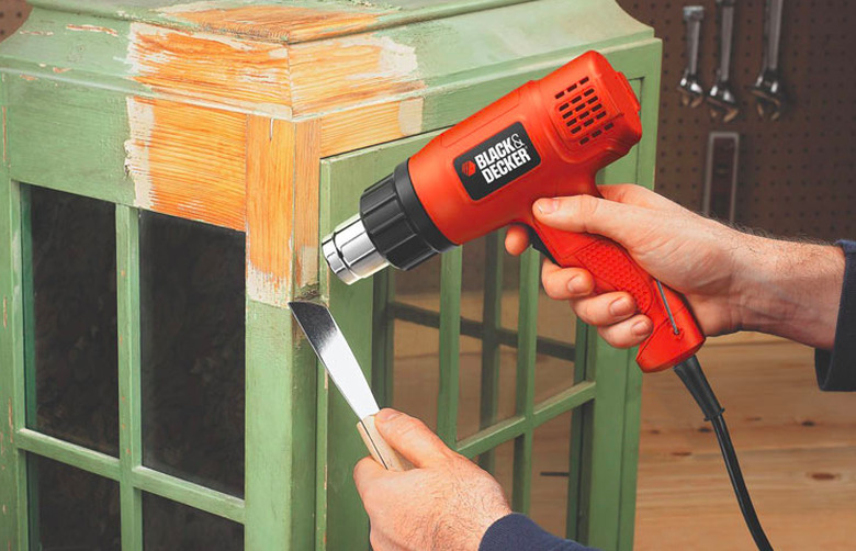 Heat gun stripping paint.