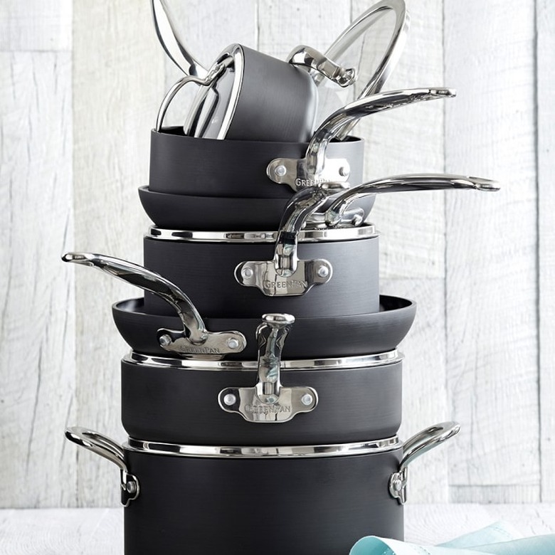Black and silver ceramic cookware set shown in a stack
