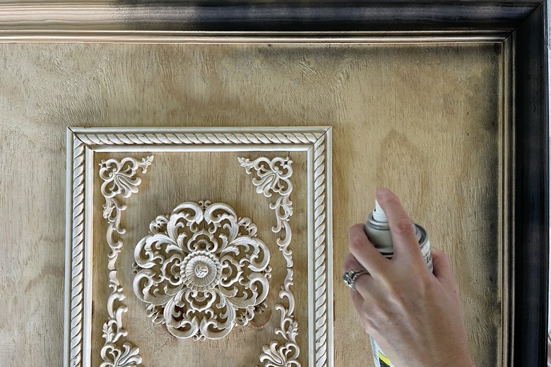 Spraying painting the fireplace cover black