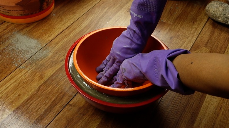 Molding concrete for DIY tabletop concrete fire bowl.