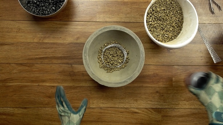 Assembling DIY concrete fire bowl.