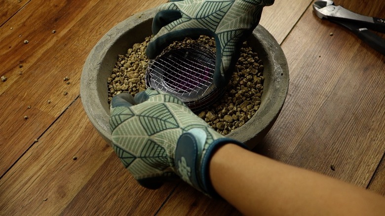 Assembling DIY concrete fire bowl.