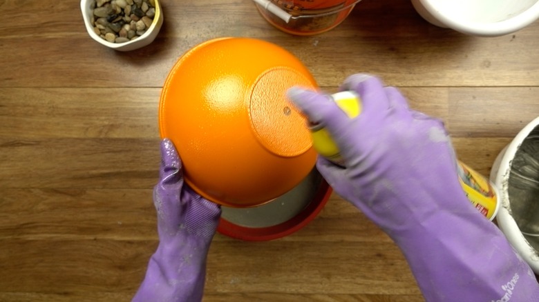 Using cooking spray as a concrete release agent for DIY tabletop concrete fire bowl.