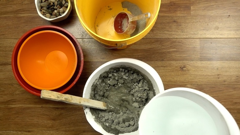 Mixing concrete for DIY tabletop concrete fire bowl.