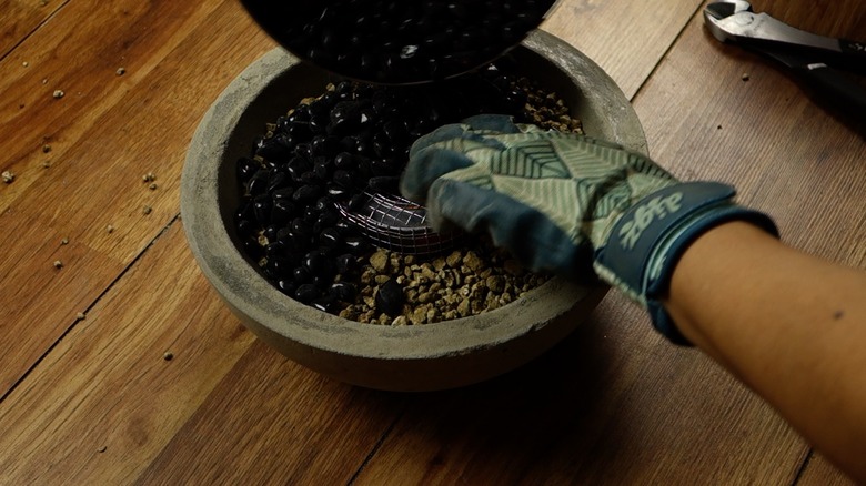 Assembling DIY concrete fire bowl.