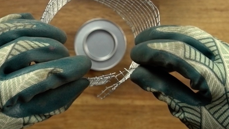 Making a fuel can holder with wire mesh for DIY concrete fire bowl.