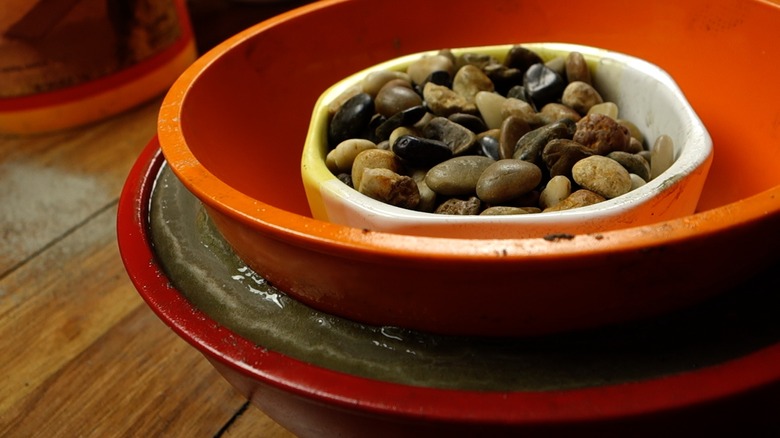 Molding concrete for DIY tabletop concrete fire bowl.