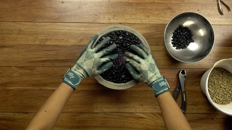 Assembling DIY concrete fire bowl.