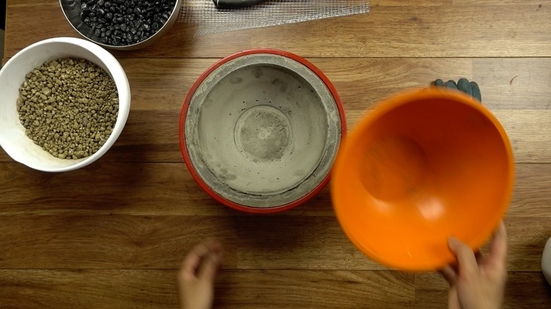 Molding concrete for DIY tabletop concrete fire bowl.