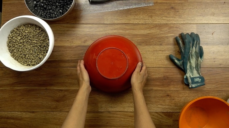 Molding concrete for DIY tabletop concrete fire bowl.