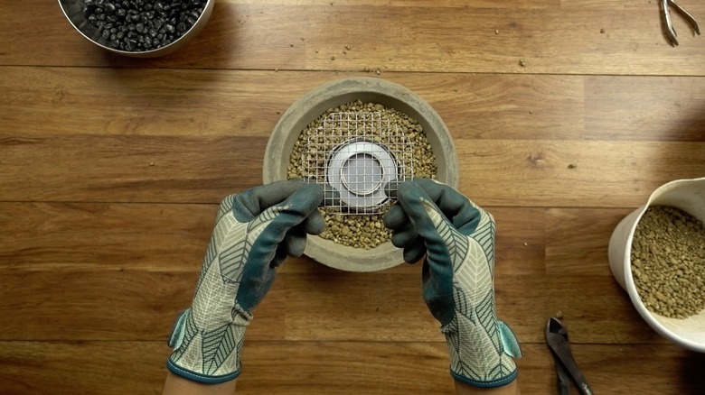 Assembling DIY concrete fire bowl.