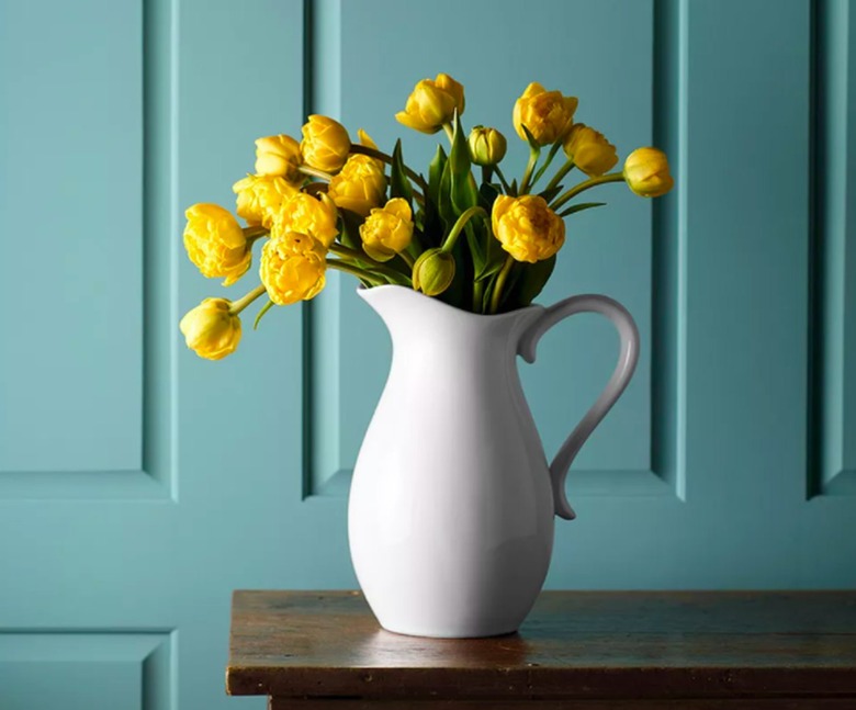 pitcher with yellow flowers