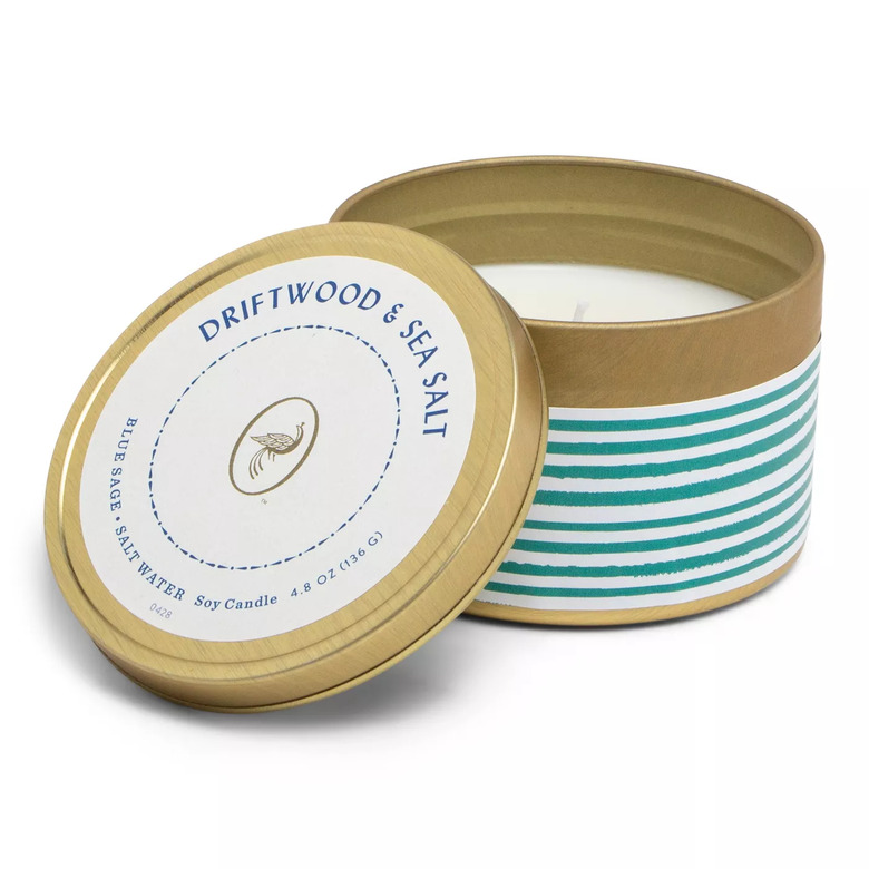 candle in gold tin with striped design