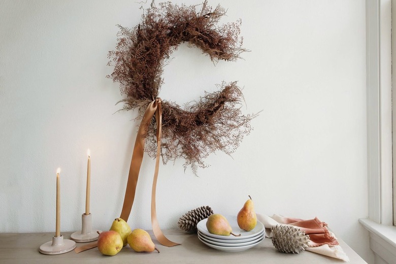 Grapevine and dried Plumosus fern crescent moon wreath with a neutral satin ribbon
