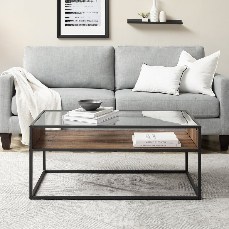 Metal framed coffee table with glass top and wood veneer open shelf