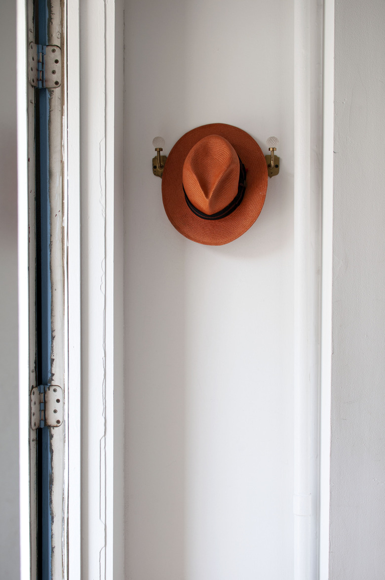 hat hung on wall