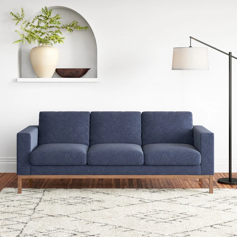 navy sofa with wood base