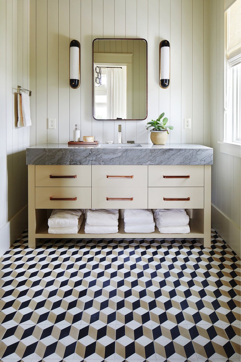 cream bathroom with bronze fixtures