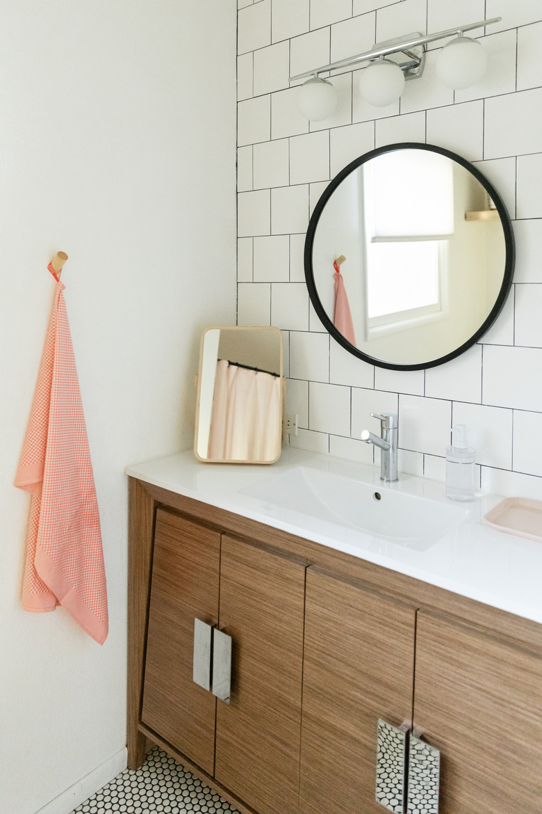 bathroom with white subway tile wall