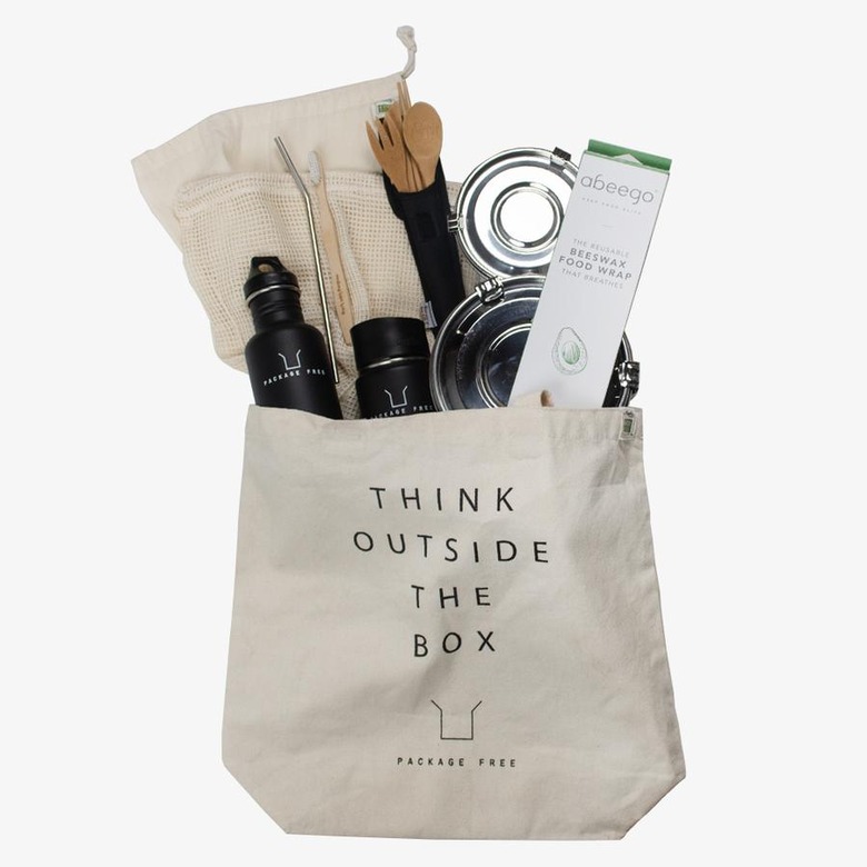 Tote bag with think outside the box in text and a variety of eco-friendly items inside