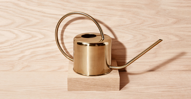 brass watering can
