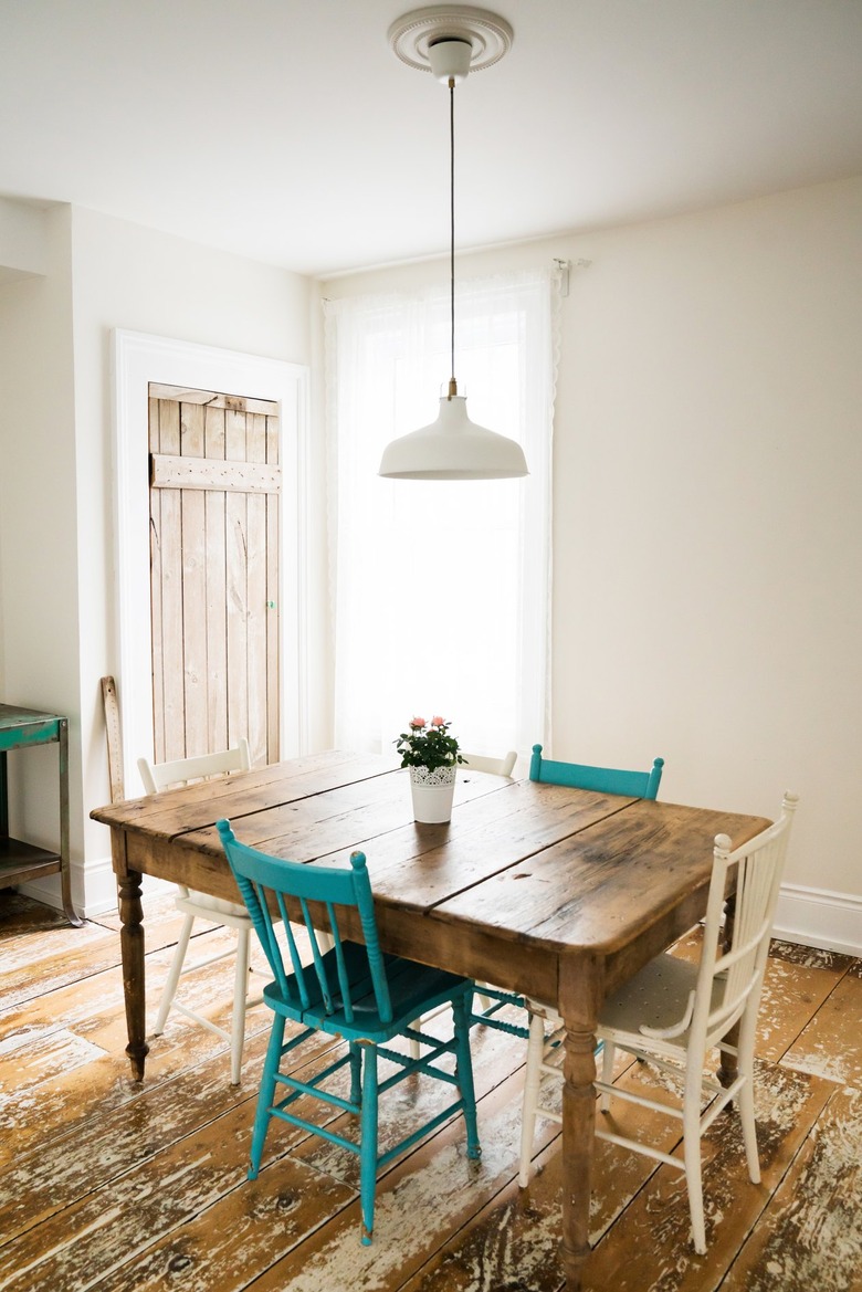 a dining table in a room with a wood floor