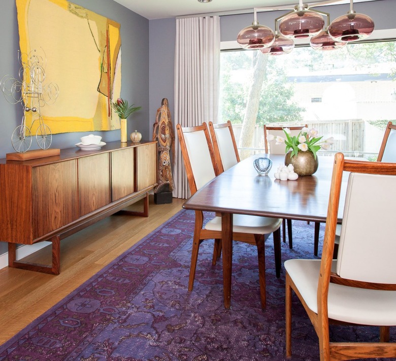 Dining room with yellow art