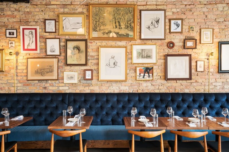 Deep blue fabric bench seating and artwork collage