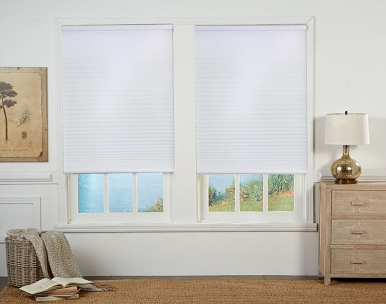 White honeycomb shades in a bedroom