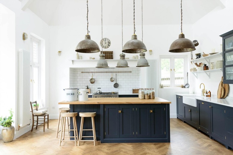 white and blue farmhouse kitchen with reclaimed metal lights