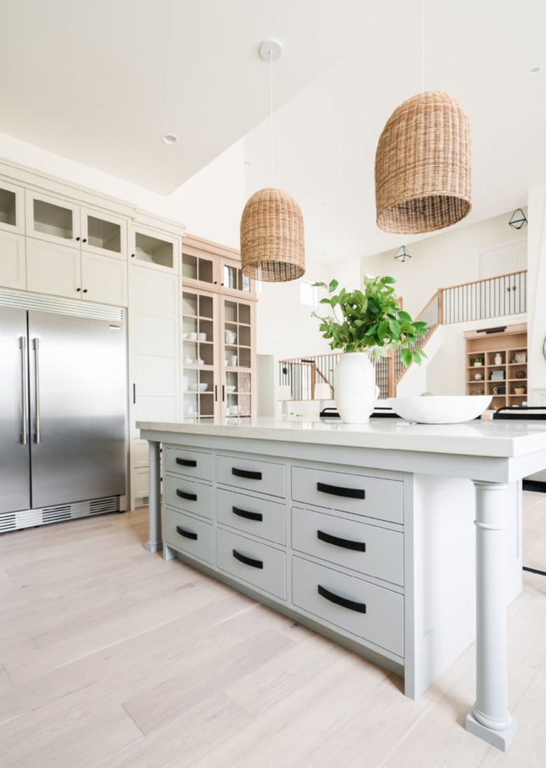 white farmhouse kitchen with basket style pendant lights