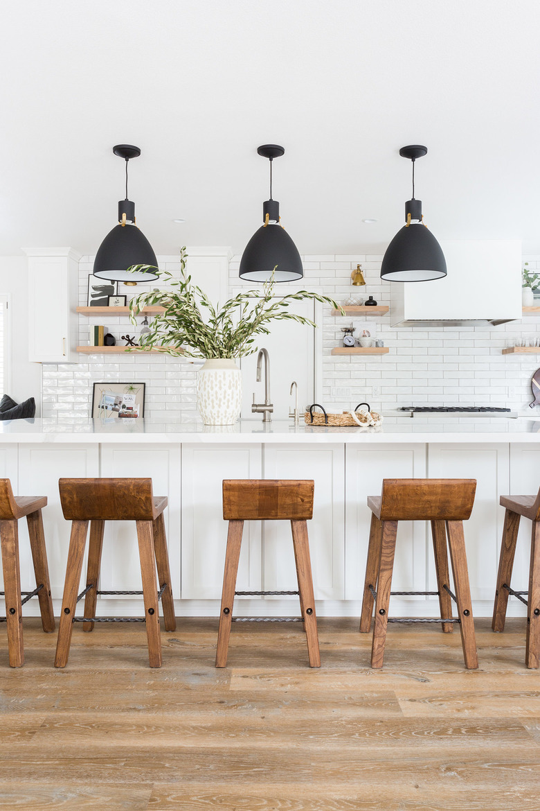 Farmhouse kitchen lighting with black pendant lights over island