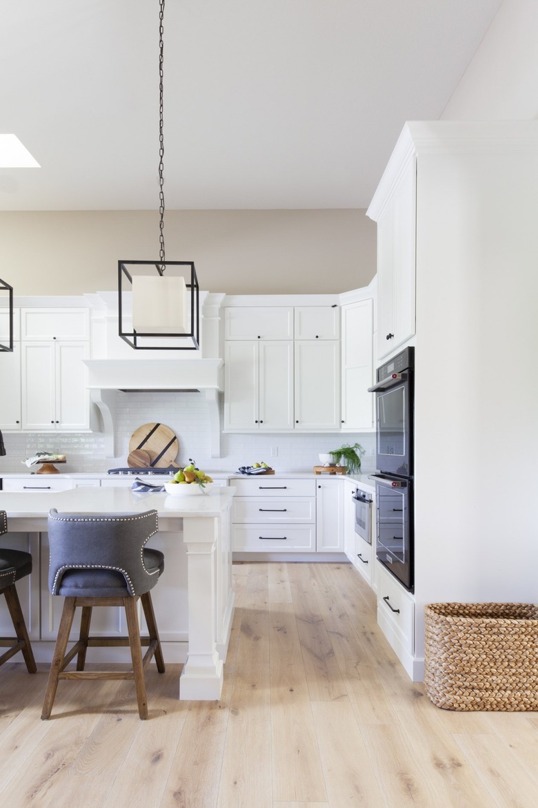 white farmhouse kitchen with geometric pendant lights