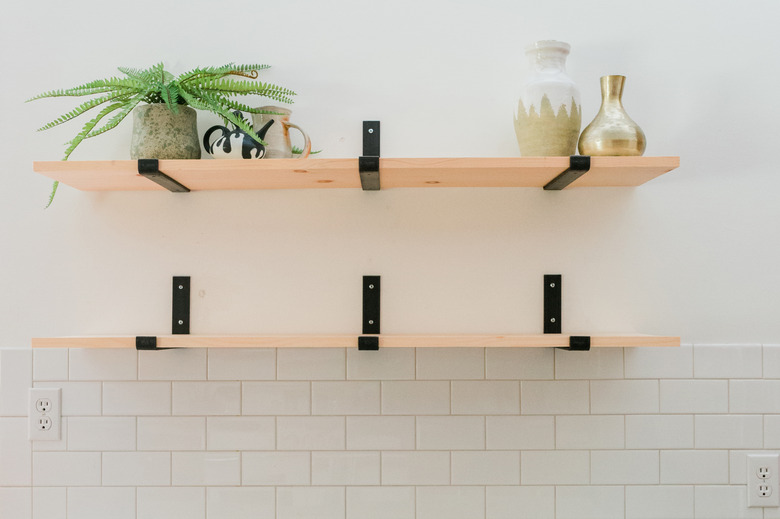 Use the upper shelf to hold keepsakes that aren't used every single day.