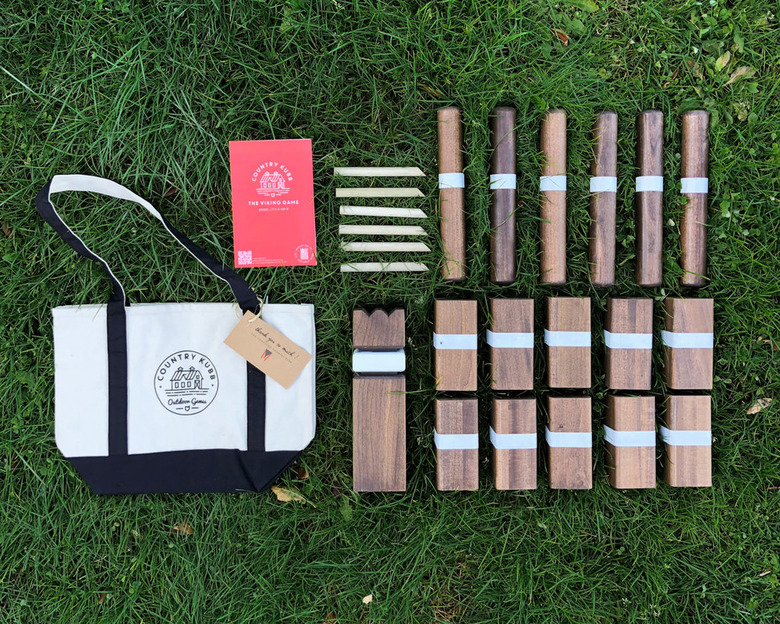 A Kubb set against a lawn.