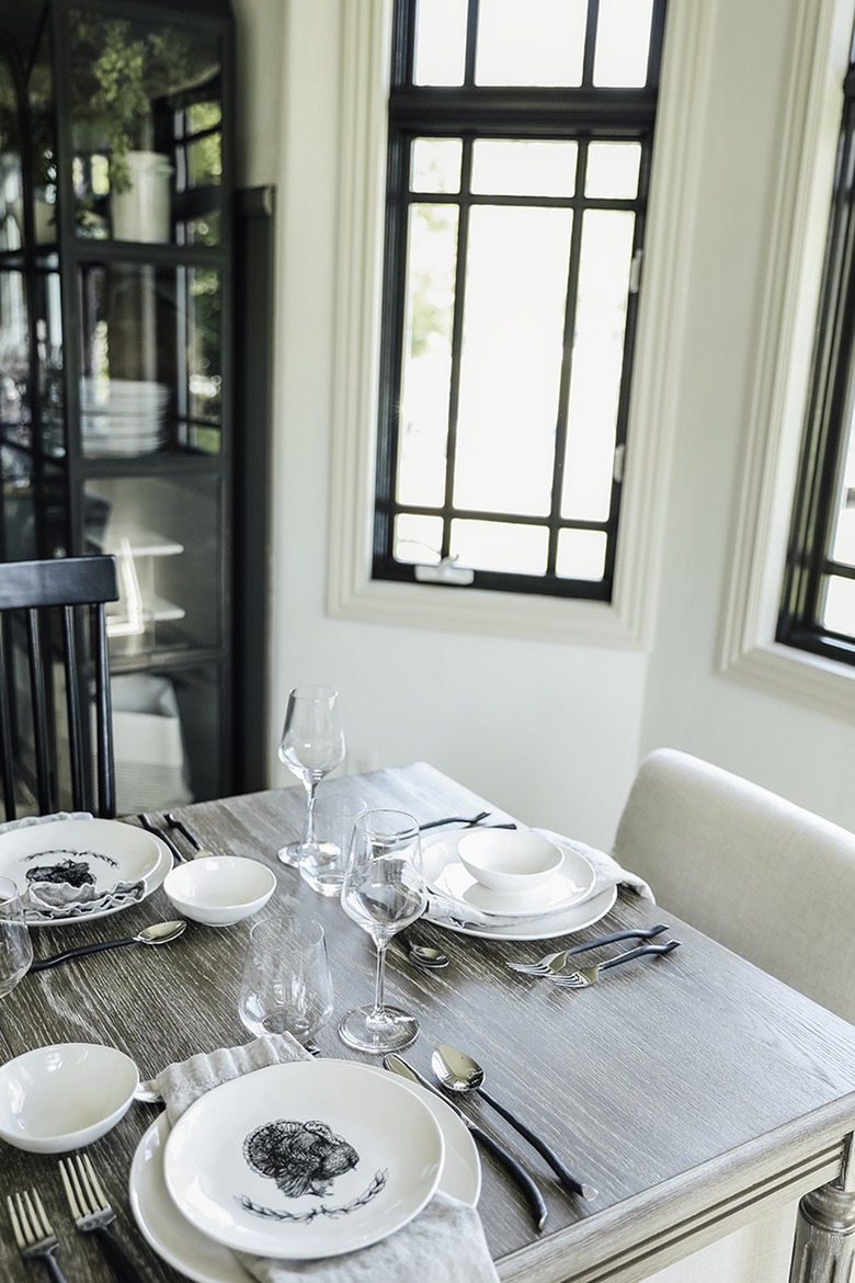 black and white thanksgiving table setting with turkey plates