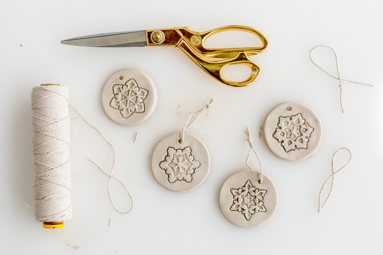 Pull string through the holes for hanging the finished ornaments.