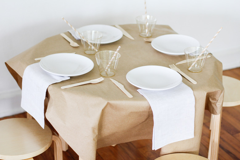Kraft paper on table with plates