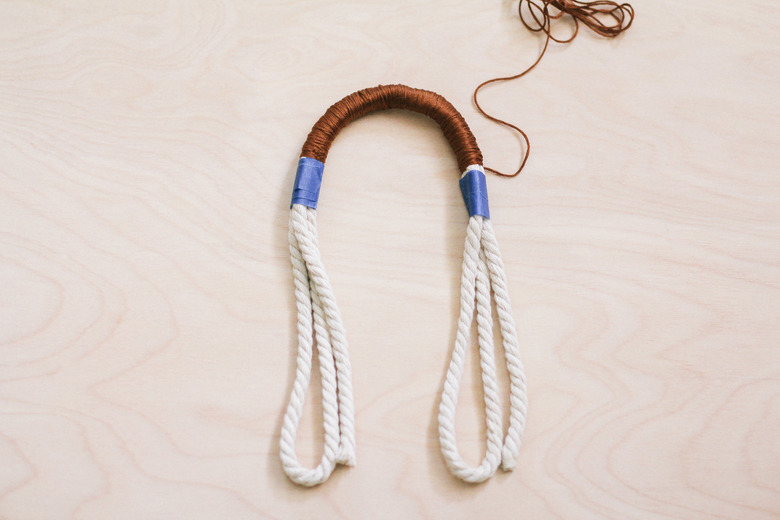 Embroidery floss wrapped around top portion of rope