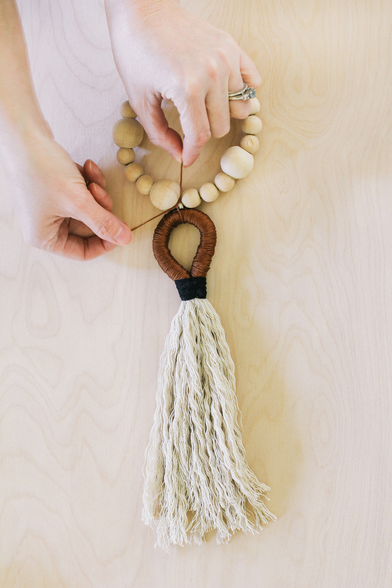 Tying tassel to wood beads