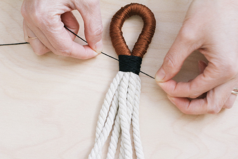 Wrapping a different embroidery floss color around base of loop