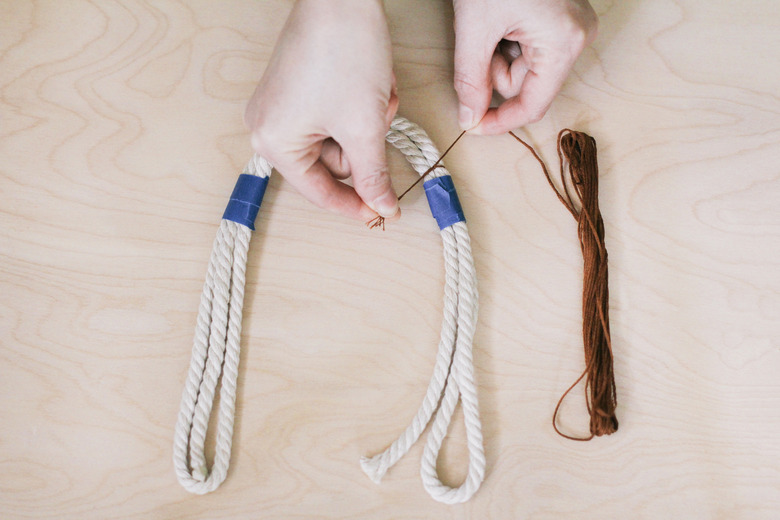 Tying embroidery floss around rope strands