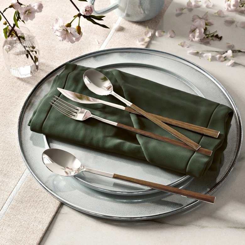 wood and stainless steel cutlery on table