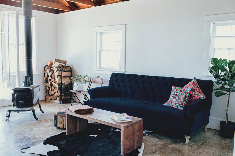 small living room with concrete floors