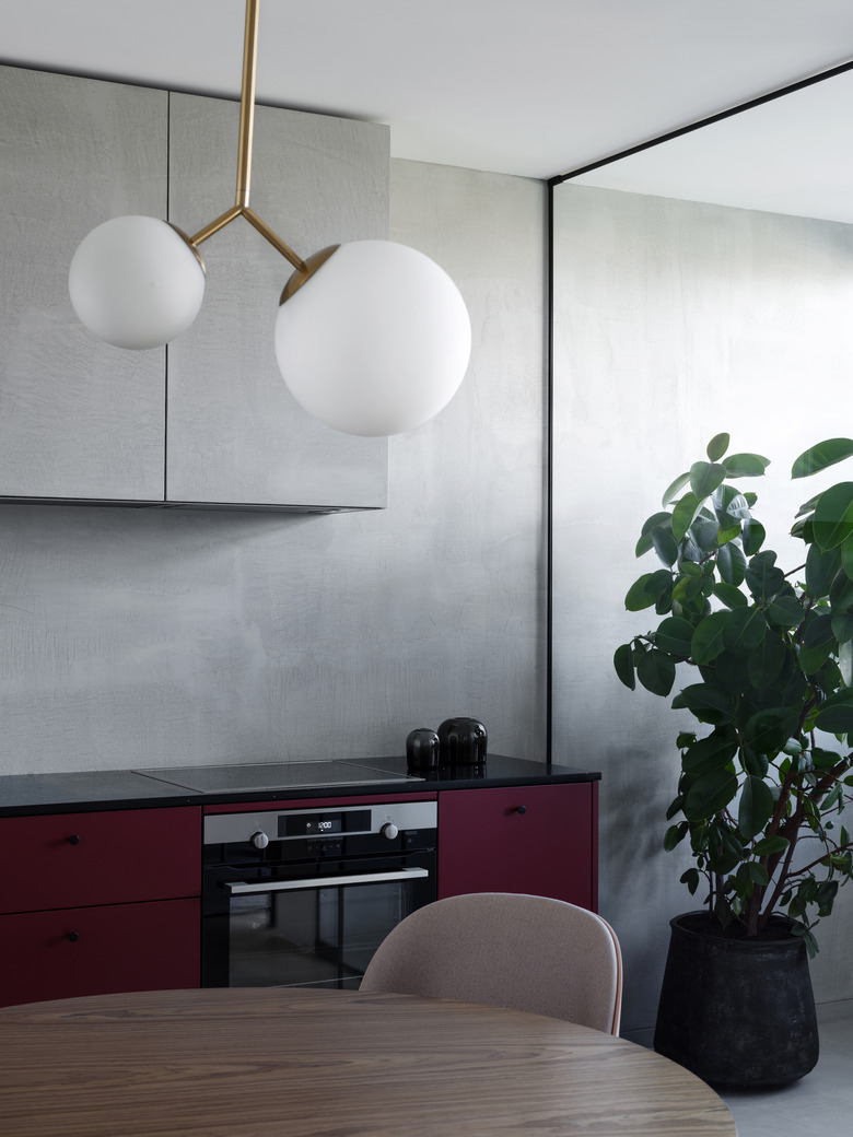eat in kitchen with gray walls and purple cabinets