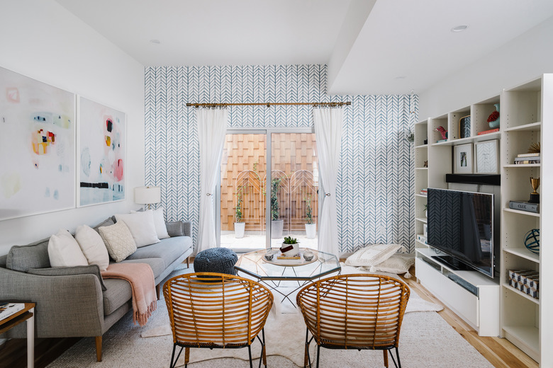 living room with blue and white wallpaper