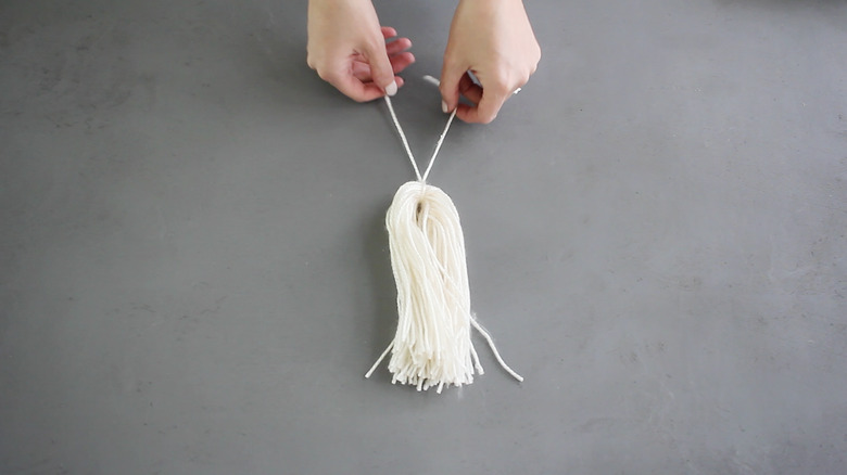 Folding the yarn strands in half